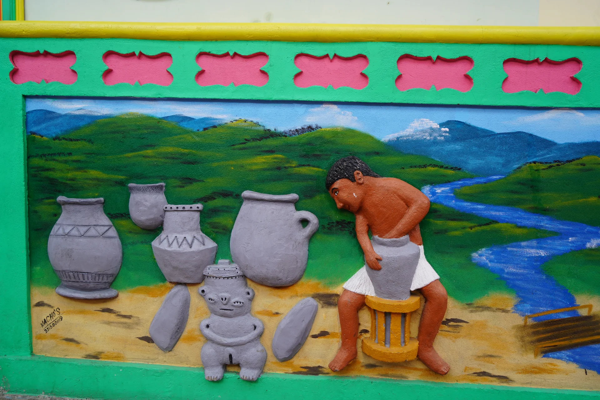 Tahamí potter making clay vessels beside a river — zócalo art, Guatapé