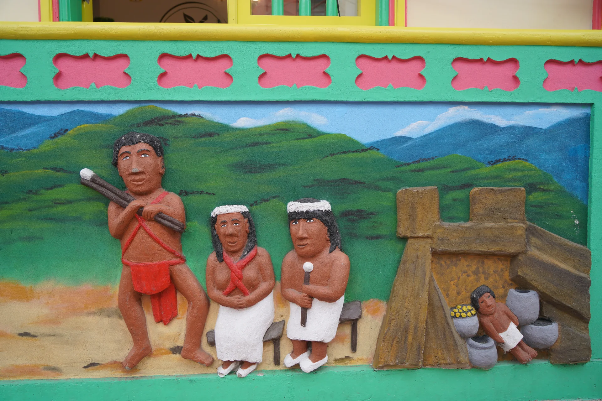 Tahamí warriors and chiefs in ceremonial dress — indigenous history panel, Guatapé